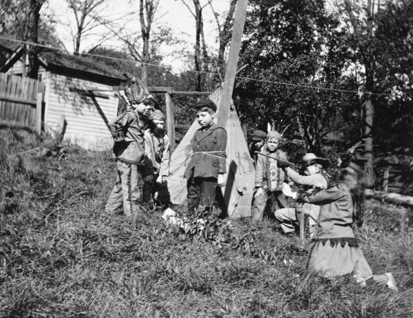 Children playing in Indian costumes