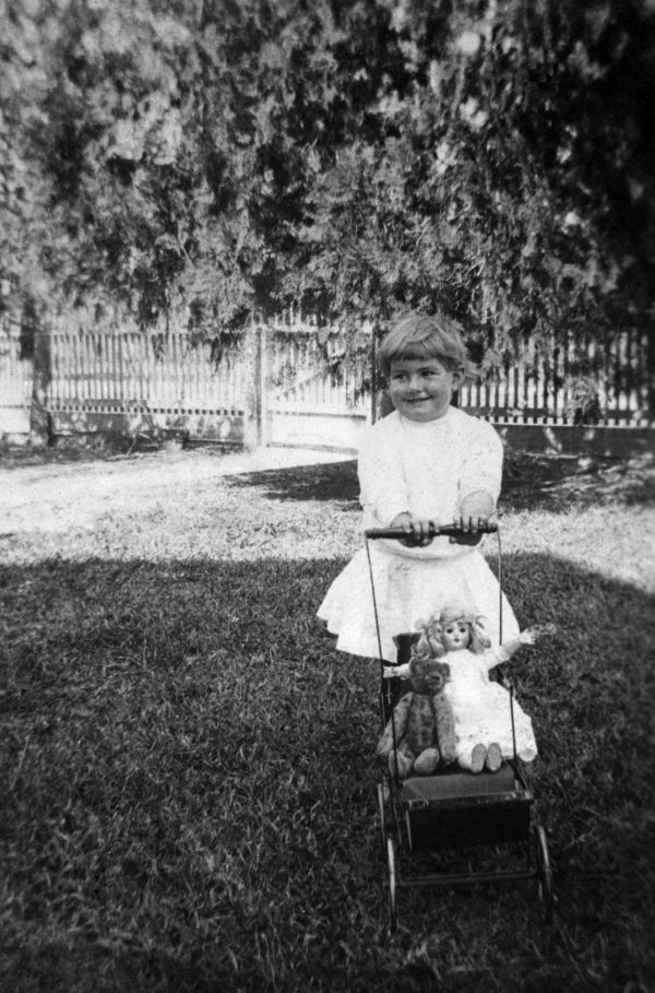 Louise Bomlay with carriage and dolls