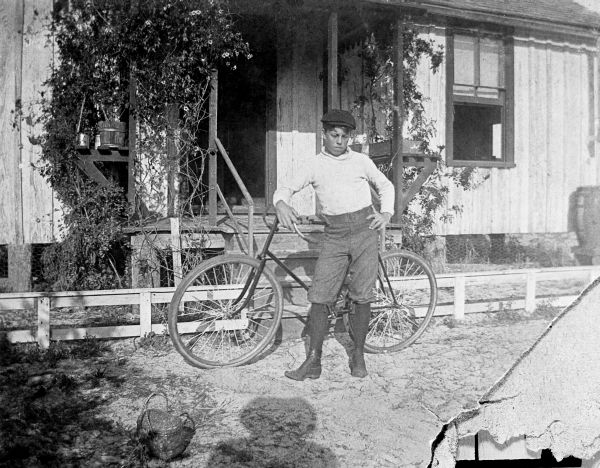 Laurance P. Allen with bicycle at S.J. Porcher home - Courtenay, Florida