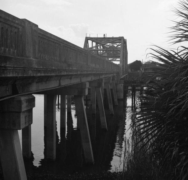 Alongside the Lake Monroe Bridge, over the Saint Johns River - border of Seminole and Volusia Counties