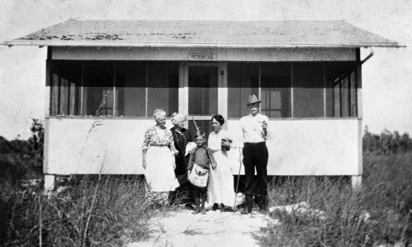 Group posed before beach cottage - Estero Island, Florida.
