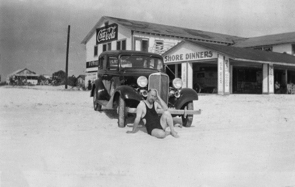 Man sitting outside the Gulf Shore Inn - Fort Myers, Florida.