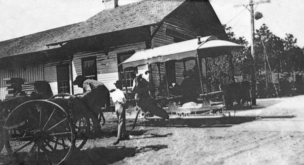 Wagon and trolley at the railroad depot - Fort Myers, Florida.