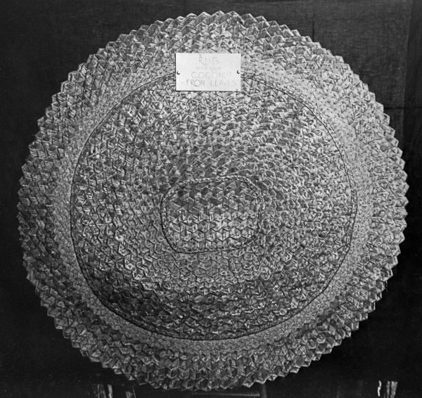 Display of rug made of coconut leaves by FERA workers