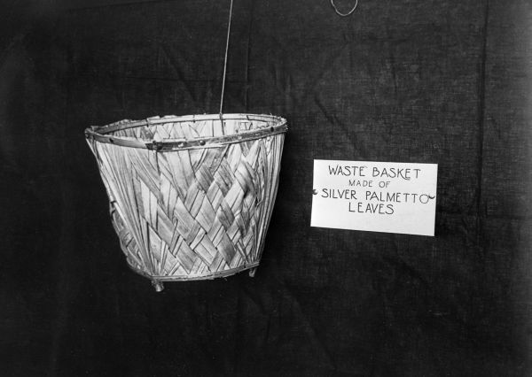 Waste basket made by FERA workers of silver palmetto leaves