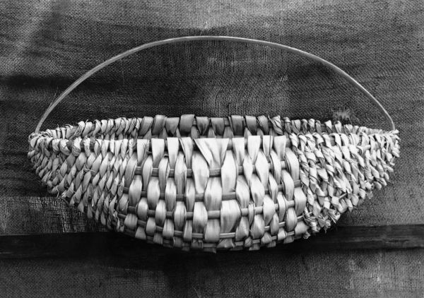 Watermelon shaped basket made by FERA workers from silver palmetto leaves