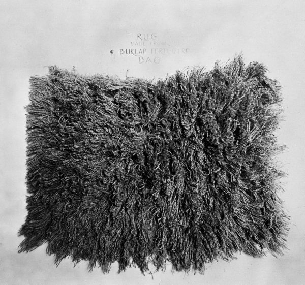 Bedside rug of burlap bags made by FERA workers - Broward County