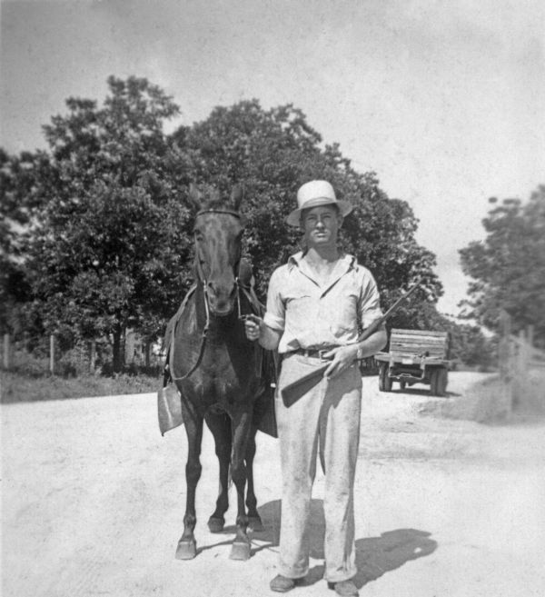 J.H. Campbell posed with horse and rifle - Hardaway, Florida
