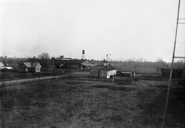 View of farm buildings and tenant houses from water tower - Hardaway, Florida