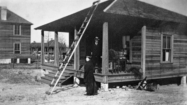 Edna Johns Miller standing beside a house - High Springs, Florida.