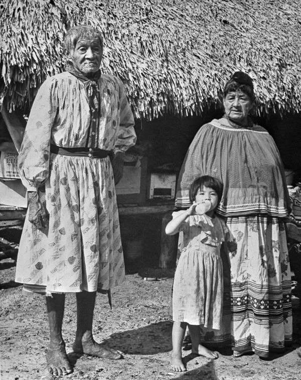 Charlie Cypress, little girl and Seminole woman - Big Cypress Reservation, Florida