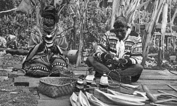 Seminole doll makers at an Indian village in the Everglades - near Miami, Florida