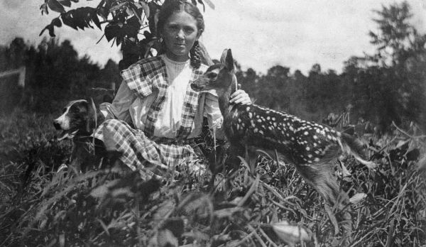 Eloise M. Missel sitting with fawn - Jefferson County, Florida