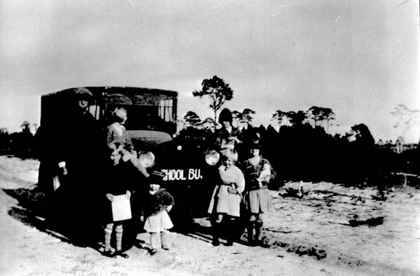 Children and driver in front of school bus - Franklin County, Florida