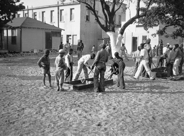 Boys playing box hockey - Miami, Florida.