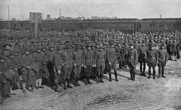 Soldiers massed next to railroad cars - Camp Joseph E. Johnston
