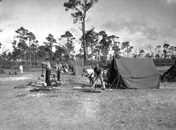 Boy Scouts chopping wood at Middle River camp - Fort Lauderdale, Florida