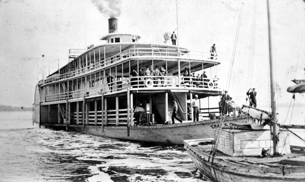 The Charles E. Cessna at Pensacola dock loading mail and supplies.
