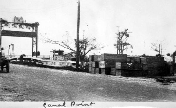 Makeshift coffins stacked beside the bridge at Canal Point