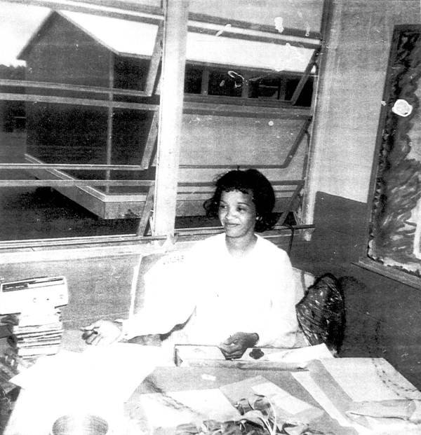 Katie Richardson sitting at her desk at school.