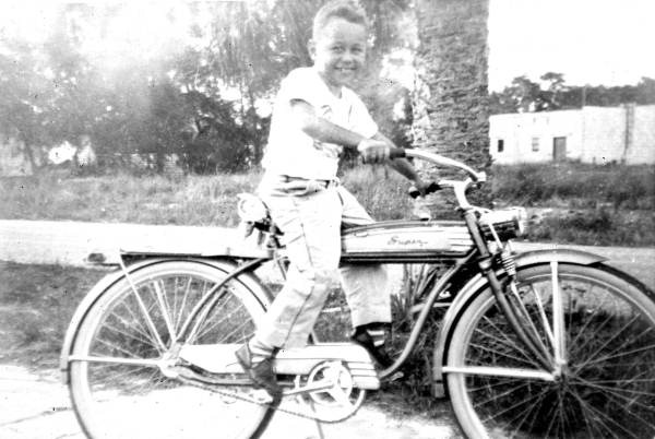 John G. Labie on the Schwinn Super bicycle he won at Western Auto grand opening - Tampa, Florida