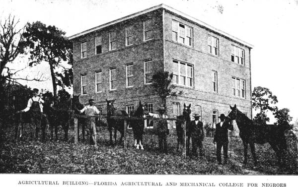 Agricultural building and students with horses