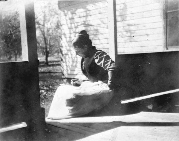 Elderly woman writing on her porch - Rockledge, Florida