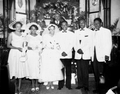 Betty and Otha Cox's wedding party with Reverend Clarence Richmond.