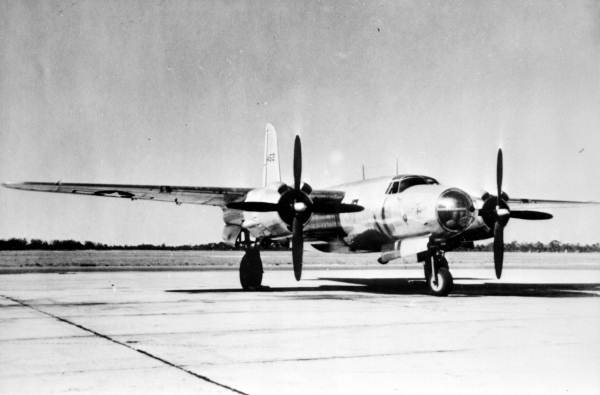 Two soldiers standing next to a B-26 Marauder at Sarasota Army Air Force Airfield