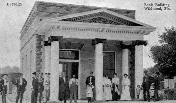 People assembled in front of bank building - Wildwood, Florida.