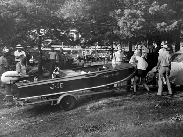 Jacksonville Outboard Motorboat Club members with a boat.