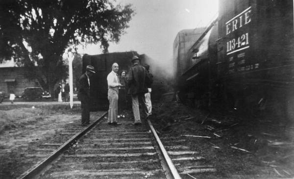 Men stand near the train wreck - Lloyd, Florida.