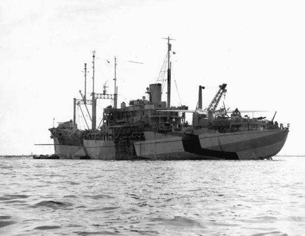 "U.S.S. St. George," AV-16 seaplane tender, commanded by Captain Robert G. Armstrong, at anchor with PBM "Mariner" aboard for repairs