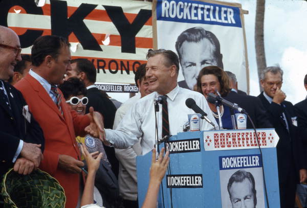 Governor Claude Kirk, in orange at left, with Republican presidential primary candidate New York Governor Nelson Rockefeller at campaign beach party