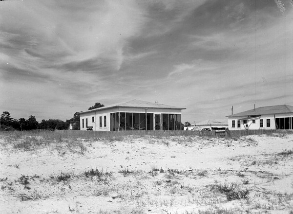 Wood-frame dwelling on beach