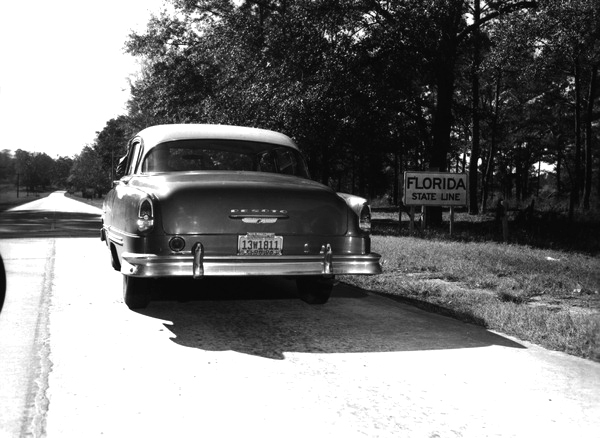 Automobile stopped on highway at Florida state line