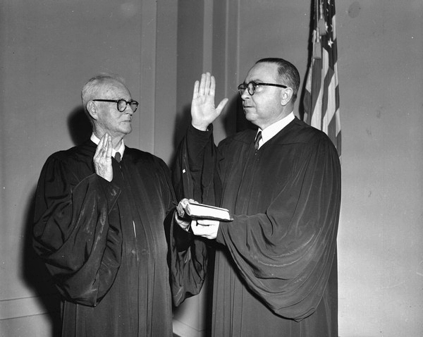 Swearing in Chief Justice John Mathews Sr. by Justice B. K. Roberts.