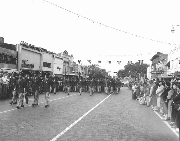 Military group marching in Governor Dan McCarty's inaugural parade.