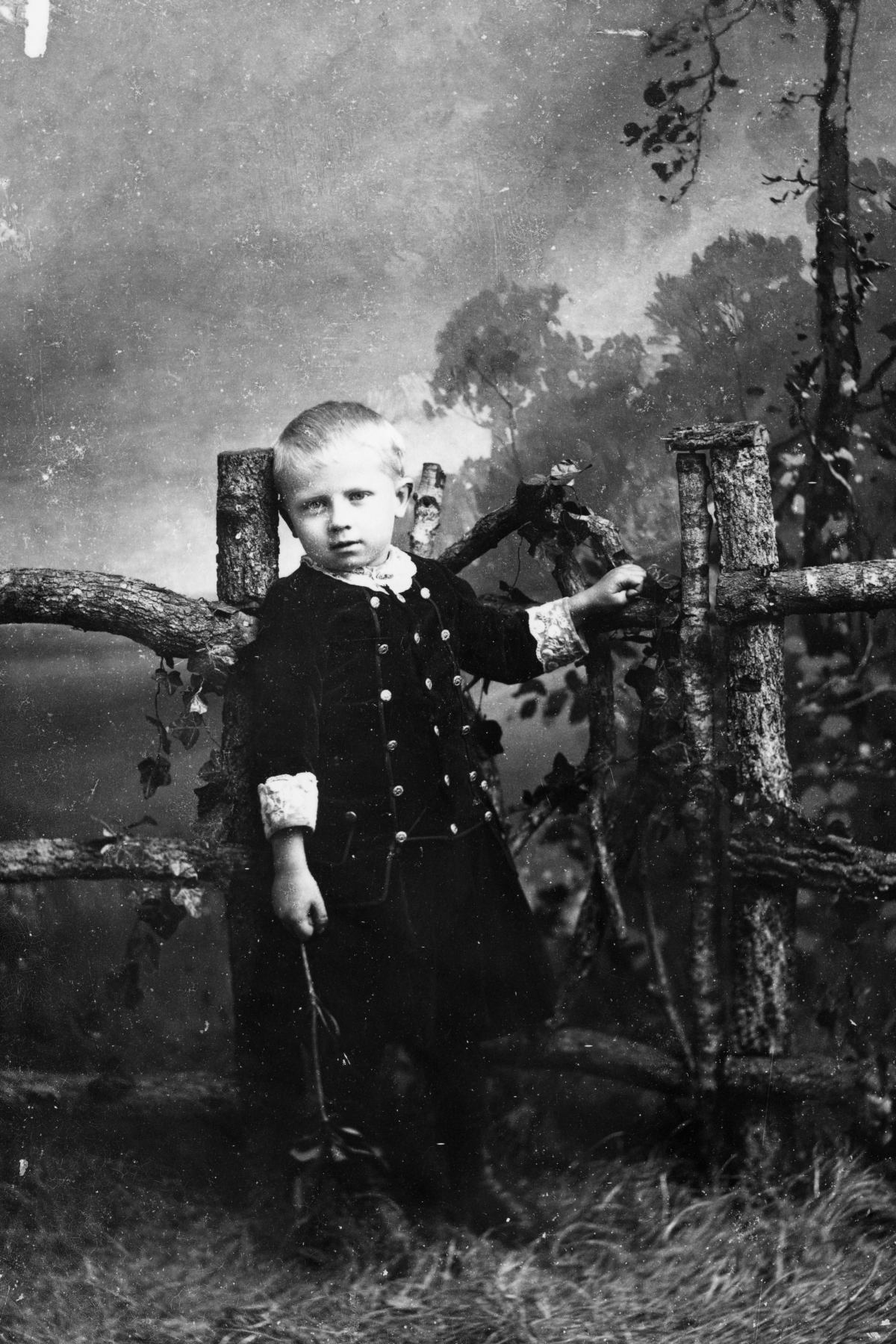 Young boy at the gate.