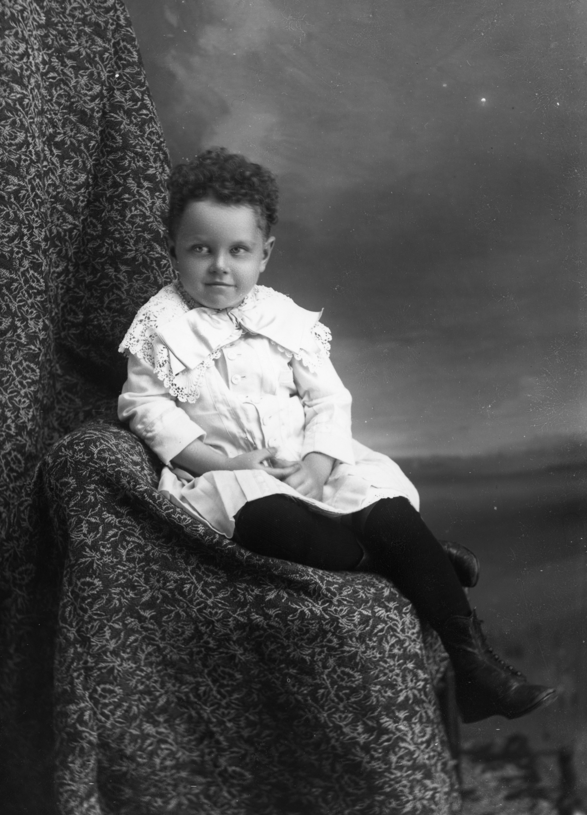 Boy with curly hair.
