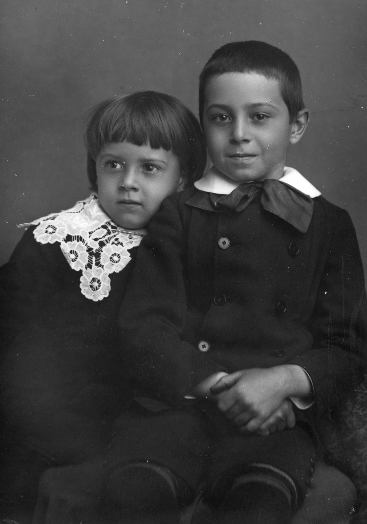 Sister leaning on her brother.