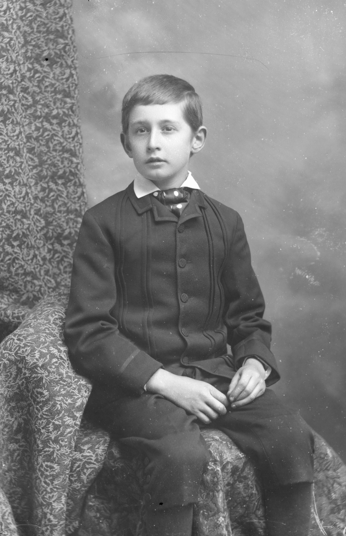 Seated boy with knickers.