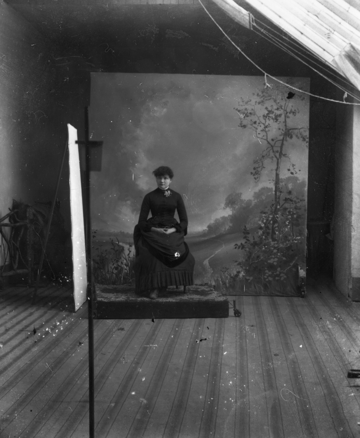 Woman seated for portrait session.