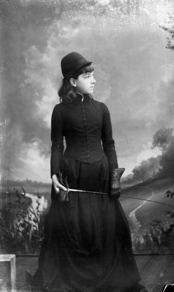 Girl in a riding habit.