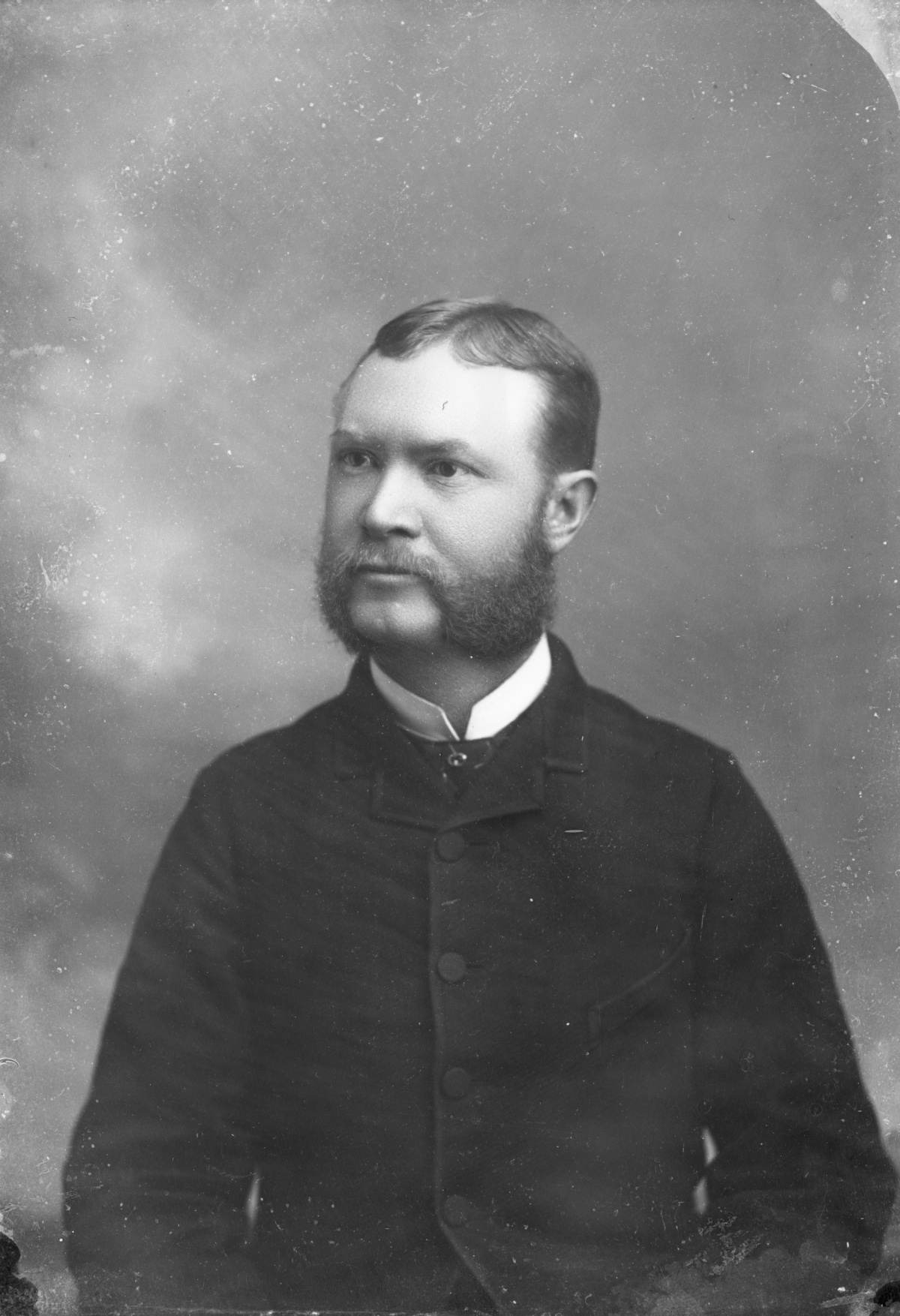 Man with mutton chops.
