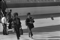 Kathleen Cleaver, right, leaving airplane during her visit to Tallahassee, Florida.