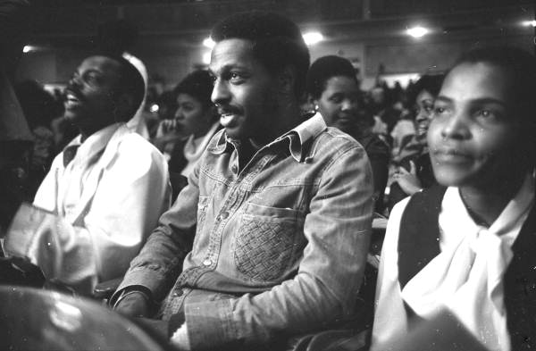 View showing audience members in auditorium listening to civil rights speakers.