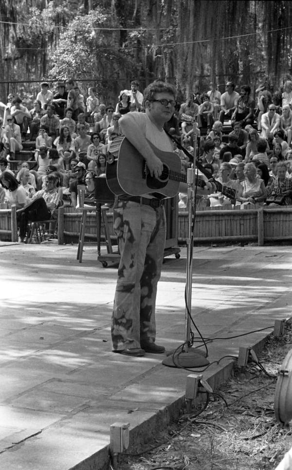 Unidentified musician playing the guitar during a performance at the 1970 Florida Folk Festival - White Springs, Florida.
