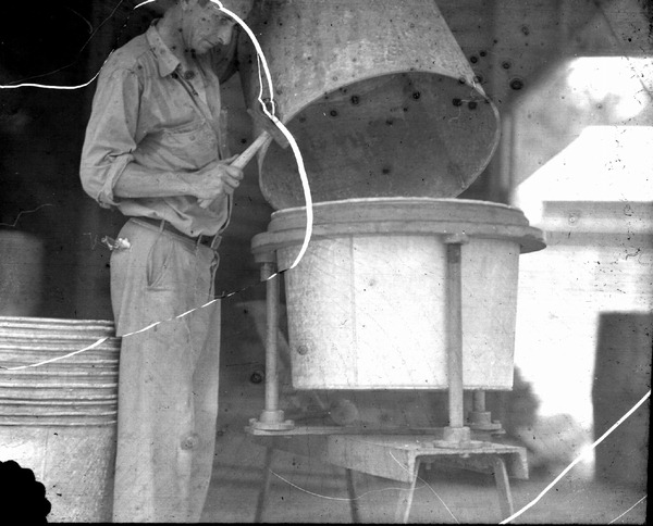 Assembling galvanized iron barrels