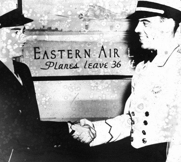 Eastern Air Line flight attendants shaking hands